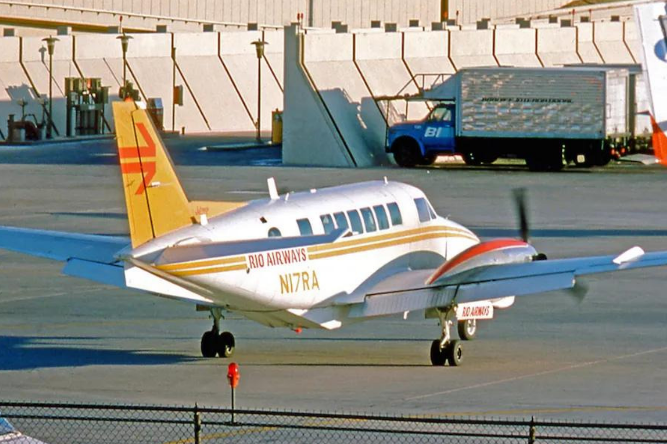 Rio Airways twin-engine airplane sitting on the ramp at GRK airport in 1977